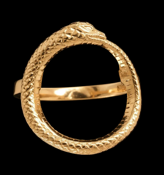 Gold ring with snake design on a black background