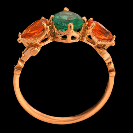 Gold ring with emerlad and orange sapphires gem stones 

