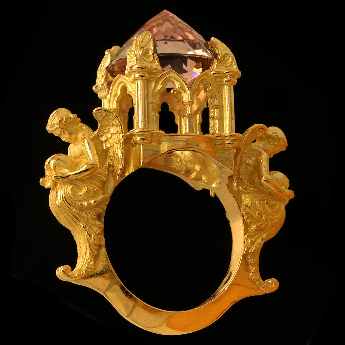 Gold ring with angels and a catherdral setting and a tourmaline bi-colour pink/green