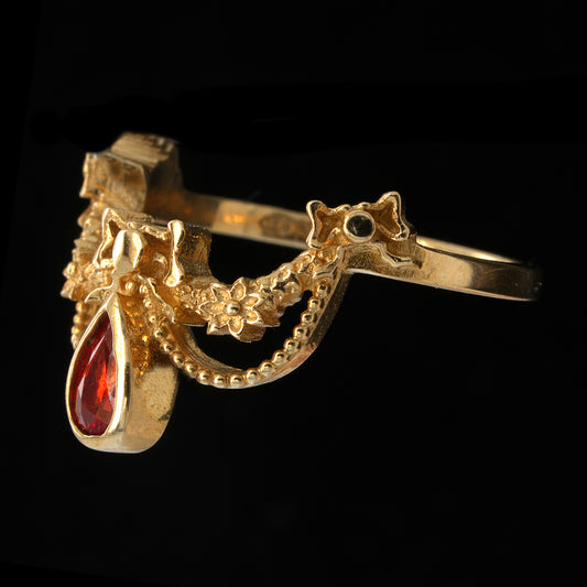 BERIBBONED ORANGE SAPPHIRE RING