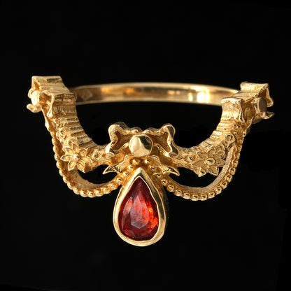 BERIBBONED ORANGE SAPPHIRE RING