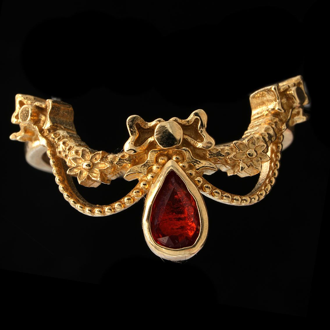 BERIBBONED ORANGE SAPPHIRE RING
