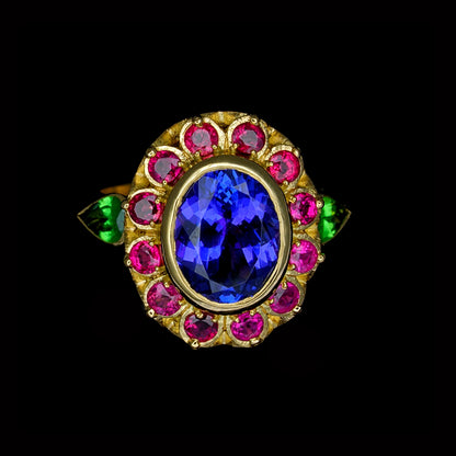 gold ring with vibrant coloured stones of purple, green and pink
