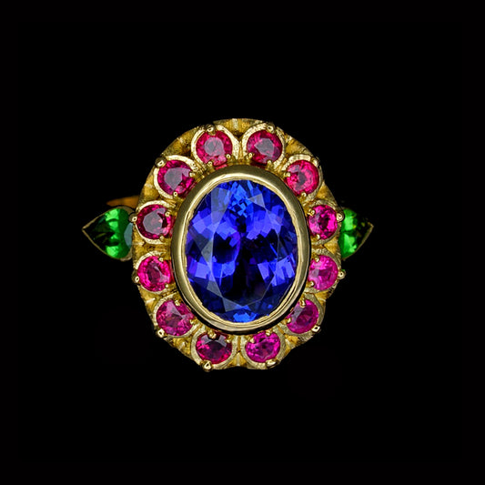 gold ring with vibrant coloured stones of purple, green and pink